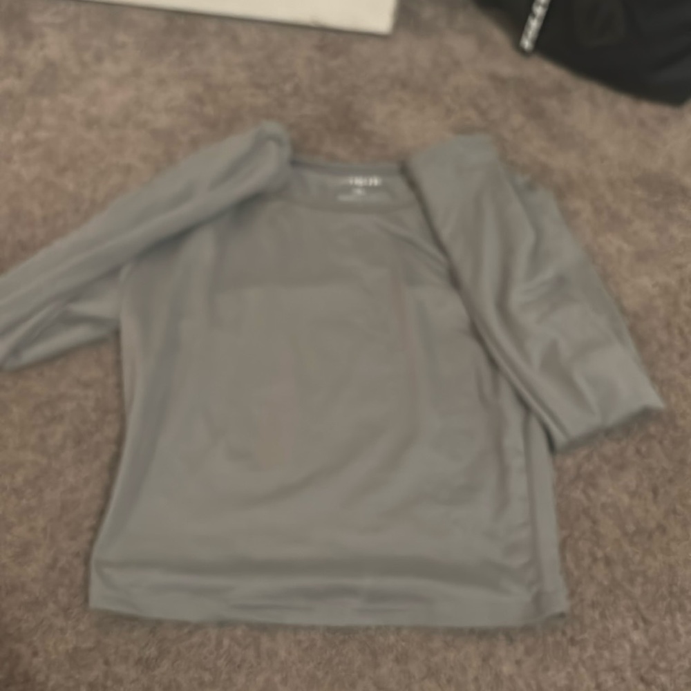 Tight grey long sleeve crop top